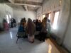 Bhabinkamtibmas Desa Daha Amankan Penyaluran Bansos Ketahanan Pangan Bersama Bupati Dompu