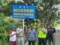 Sat Lantas Polres Dompu Amankan Kegiatan Masyarakat dan Pasang Papan Imbauan Kamseltibcarlantas
